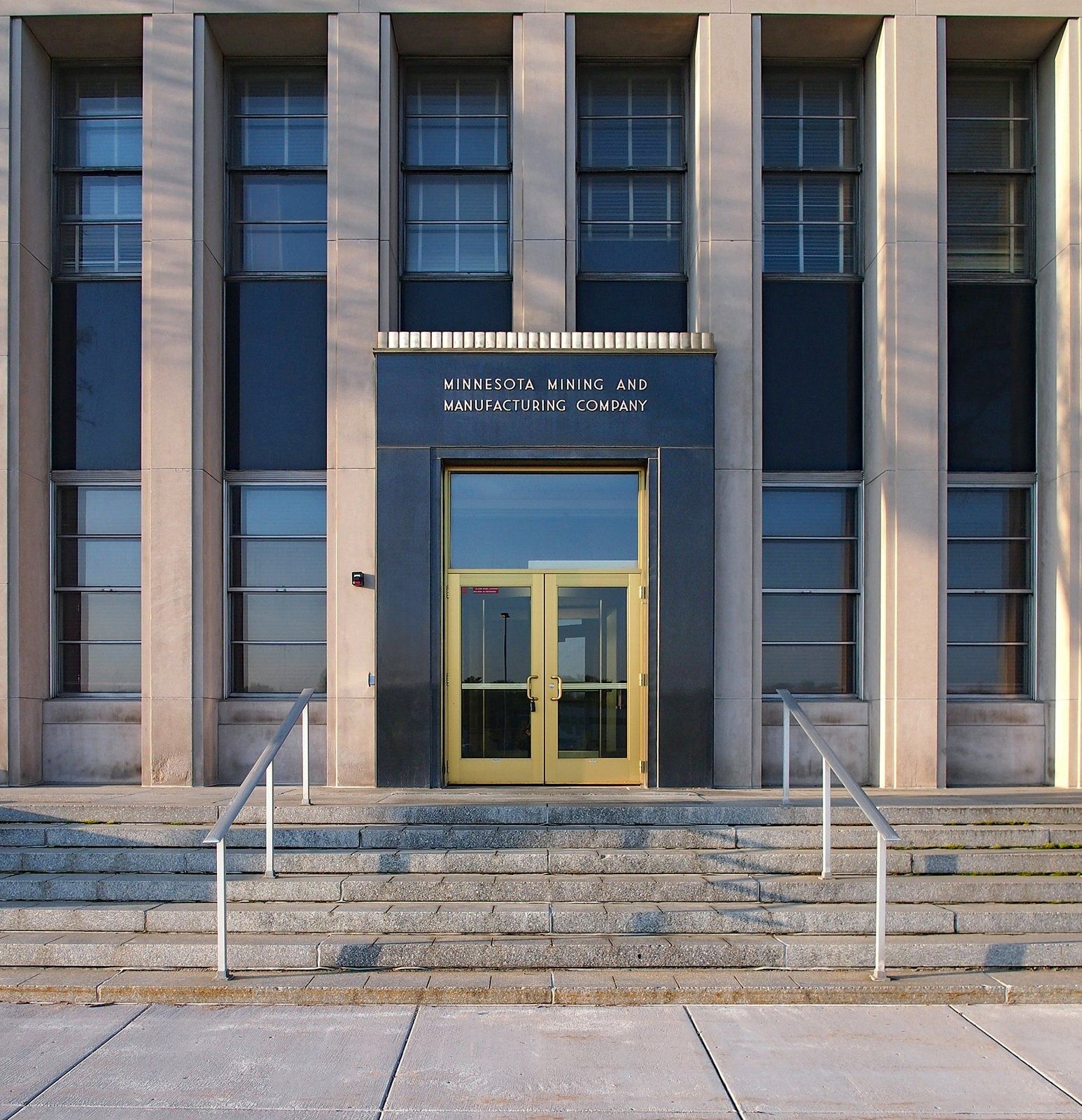 Stone entrance with gilded doors