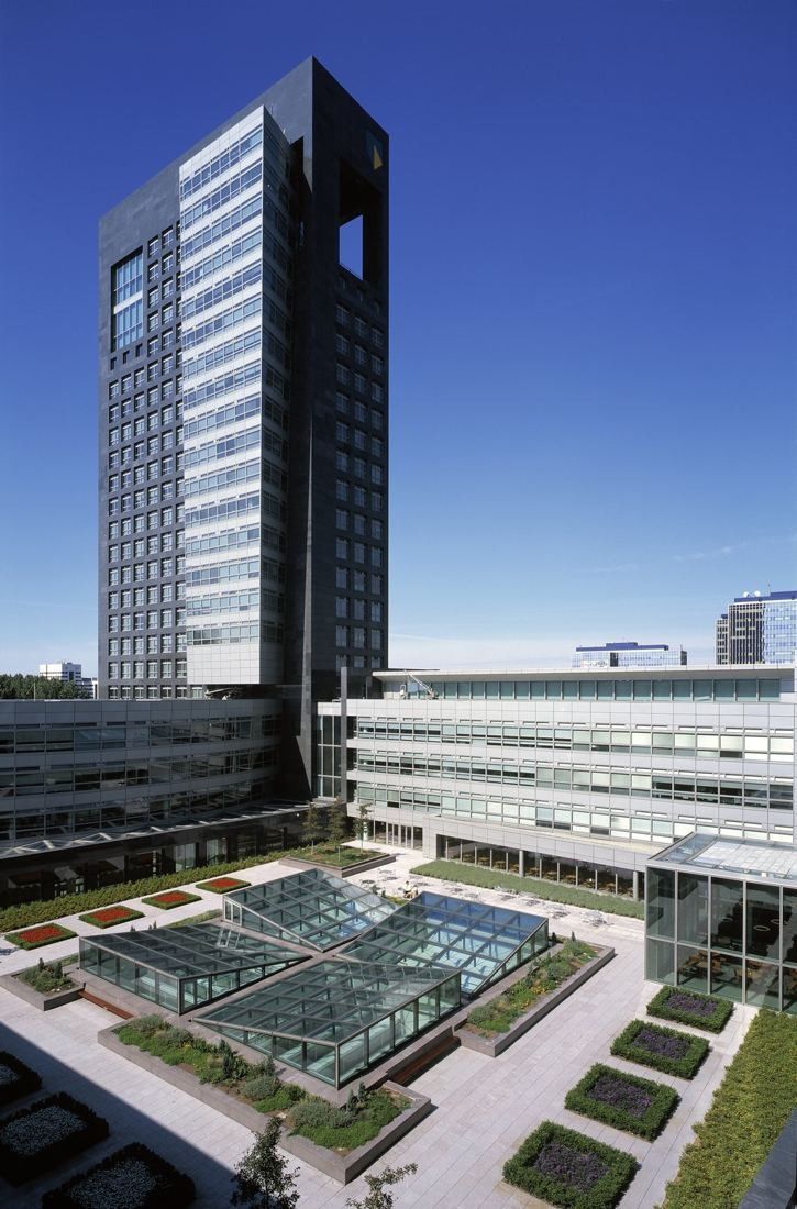 ABN AMRO: Tower rising above a courtyard with glass skylights and lawns