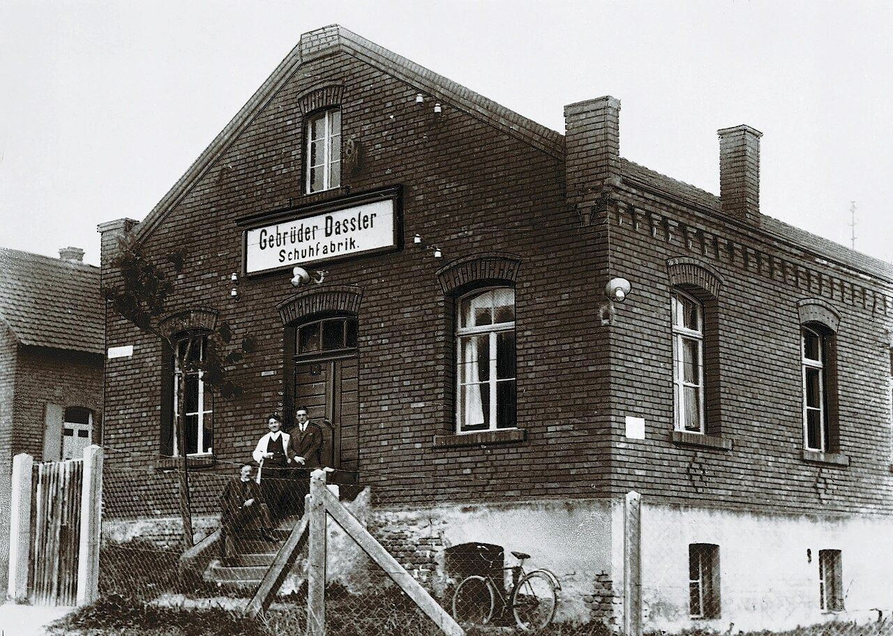 Old brick shoe factory with a Gebrüder Dassler sign