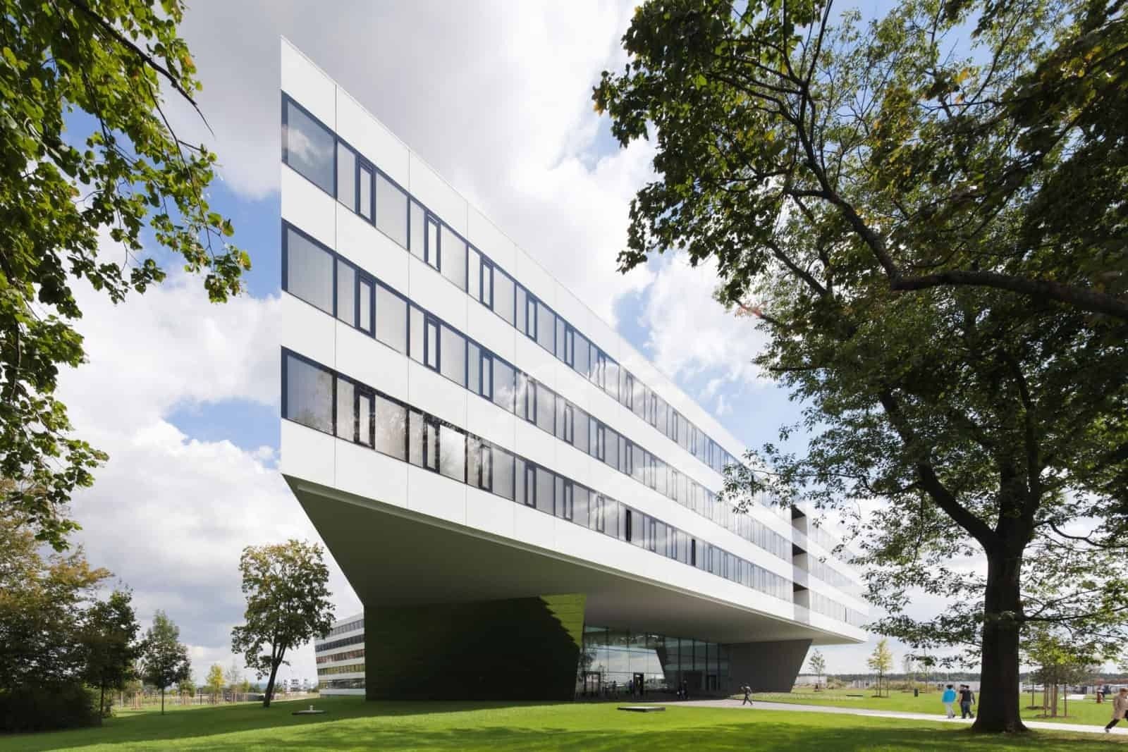 adidas: Long white office building raised over a lawn
