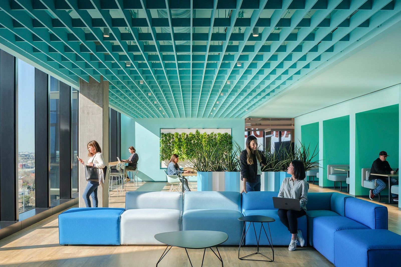 Adobe: A blue lounge with modular sofas and a teal ceiling