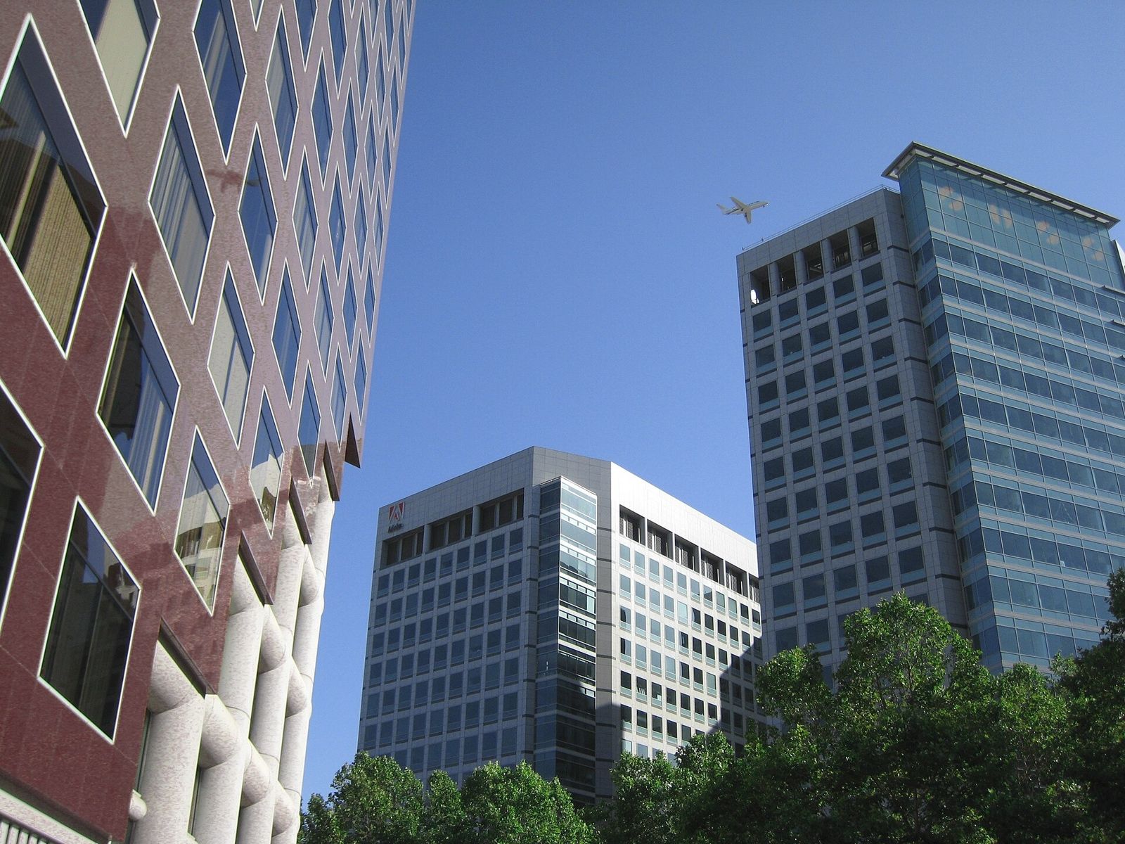 Adobe: Adobe towers rising behind a red façade