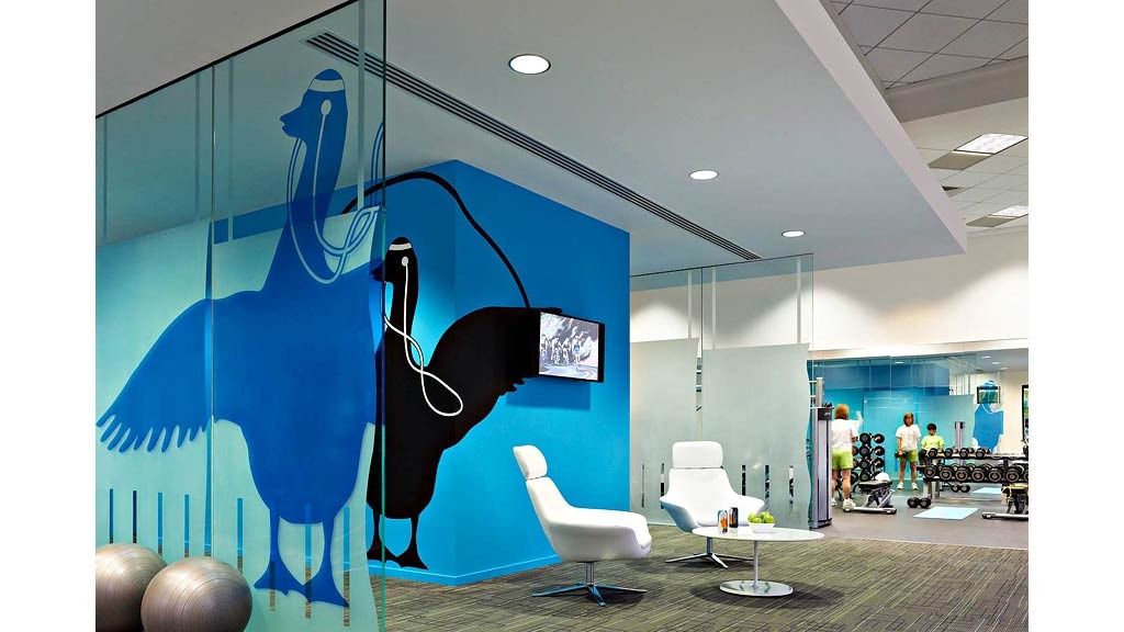 Aflac: A glass meeting room with a large blue painted duck on the wall