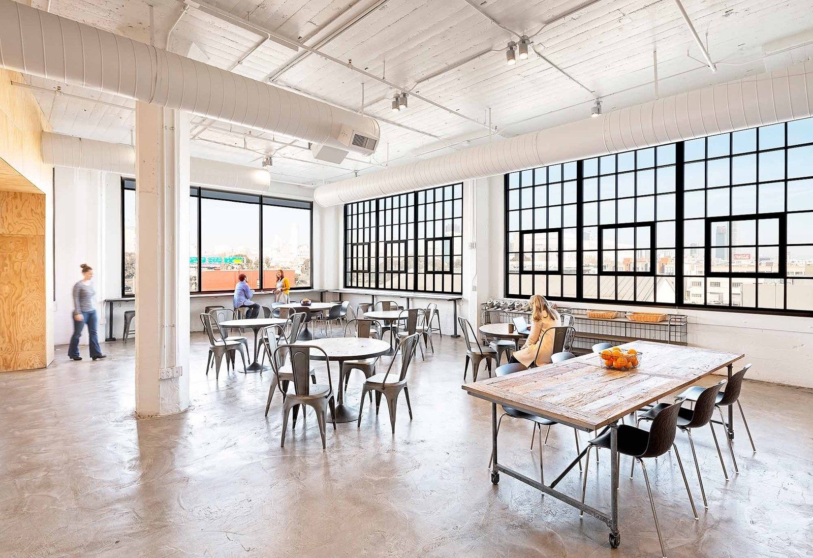 Airbnb: A dining area with big industrial windows