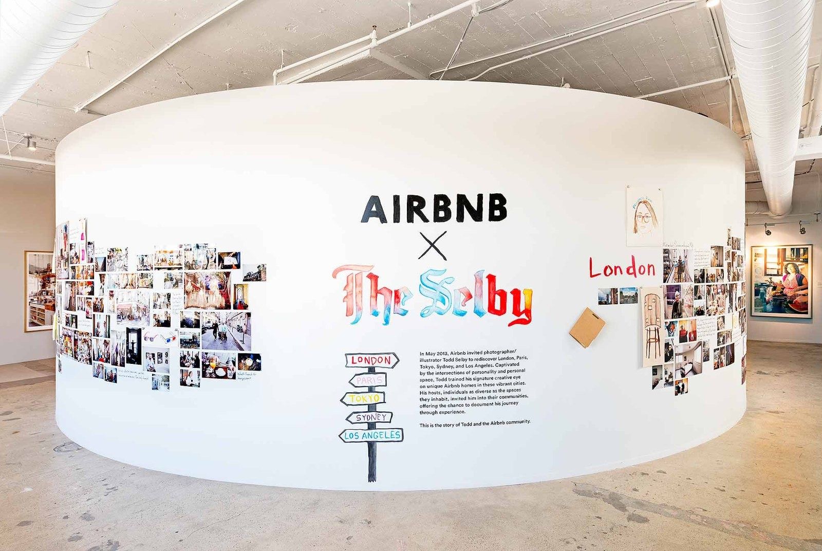 Airbnb: A round wall display about a city