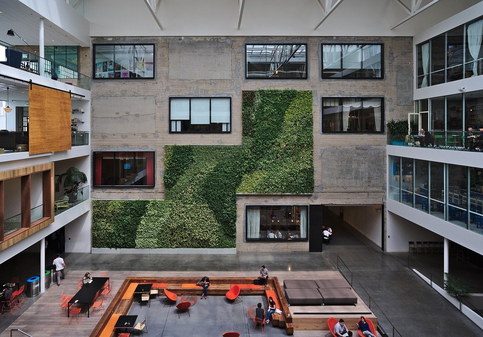 Airbnb: Looking down into the atrium, with a green wall