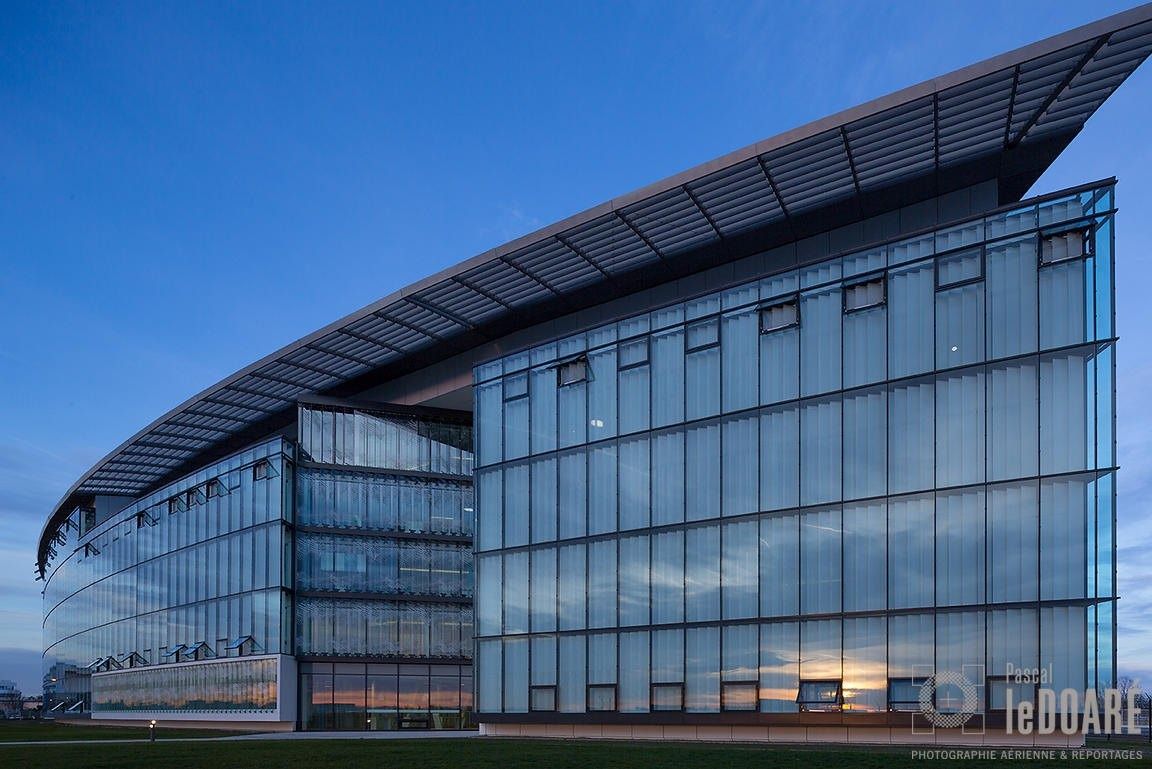 Airbus: Curved glass building at dusk
