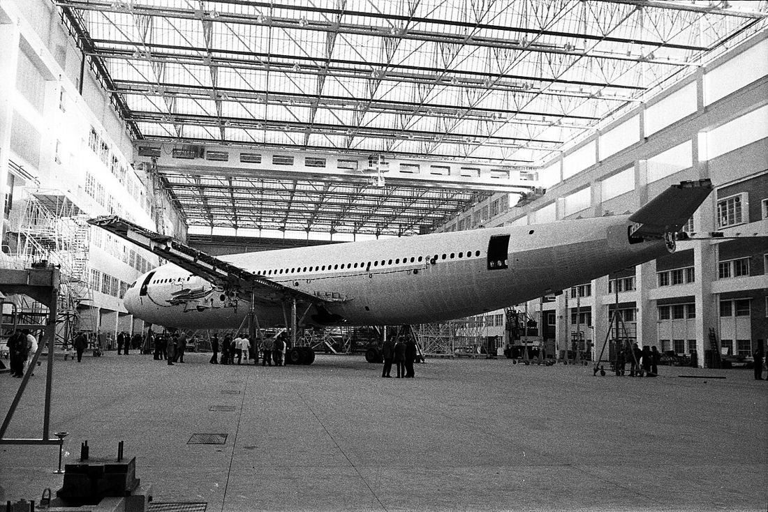 Airbus A300 B inside a large assembly hall, seen from the side