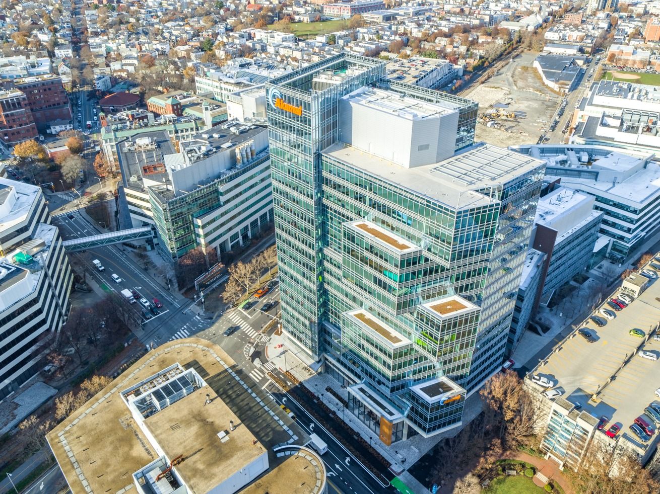 Aerial view of a glass tower among Kendall Square buildings