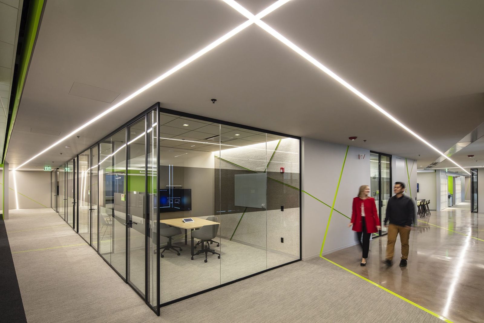 Akamai: Glass meeting rooms along a corridor with light lines