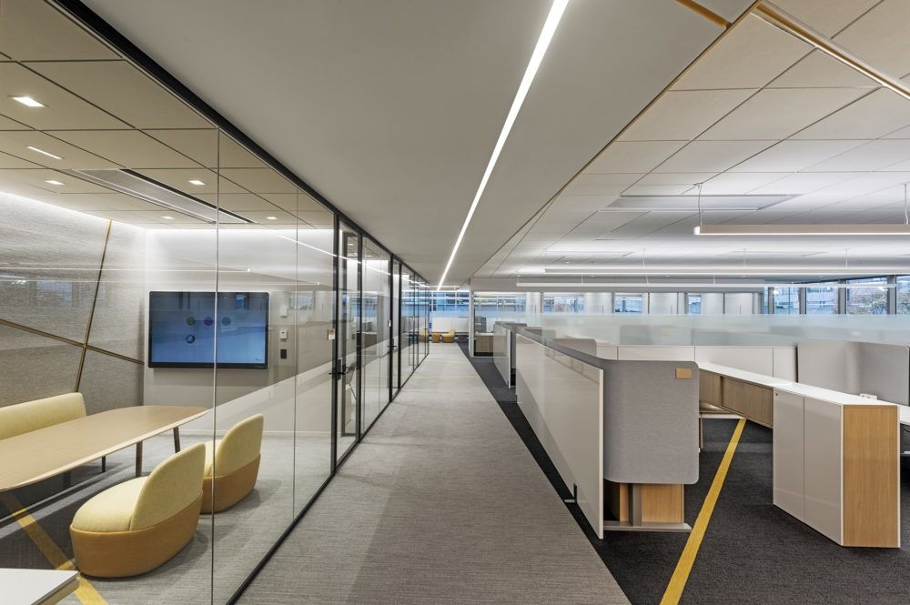 Akamai: Glass offices along a corridor of desks