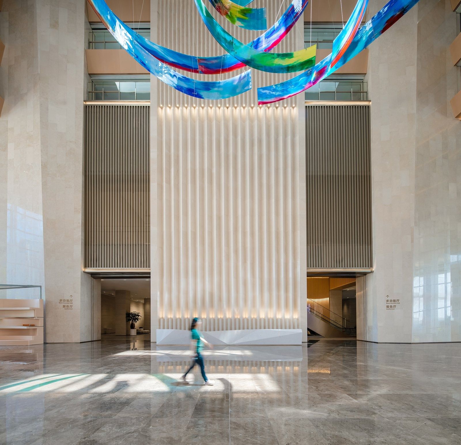 Alibaba Group: Entrance hall with a ribbon sculpture and a timber wall