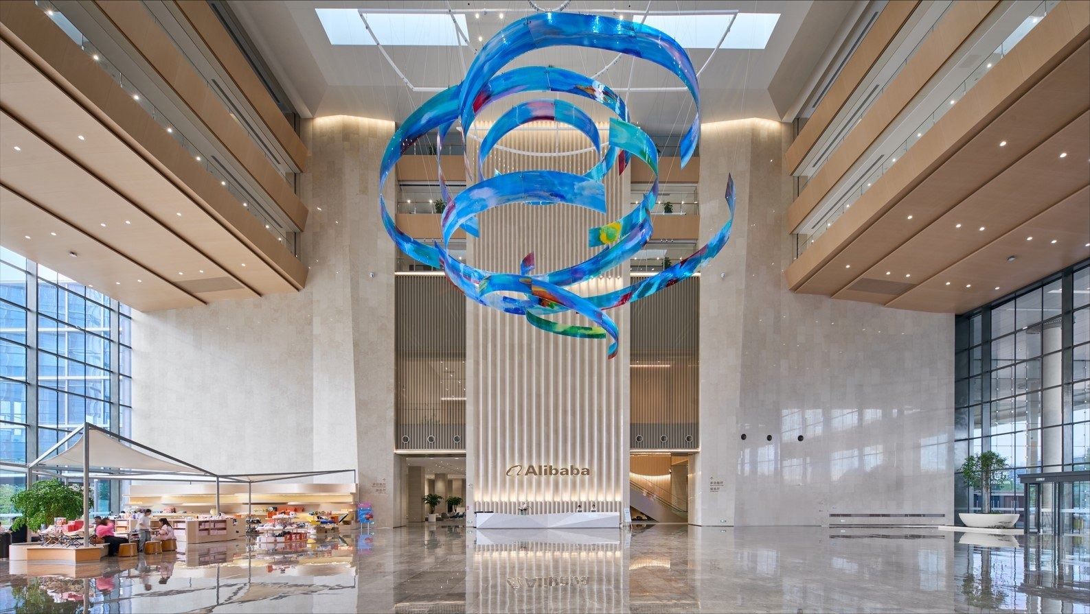 Alibaba Group: Lobby with a blue ribbon sculpture hanging from the ceiling