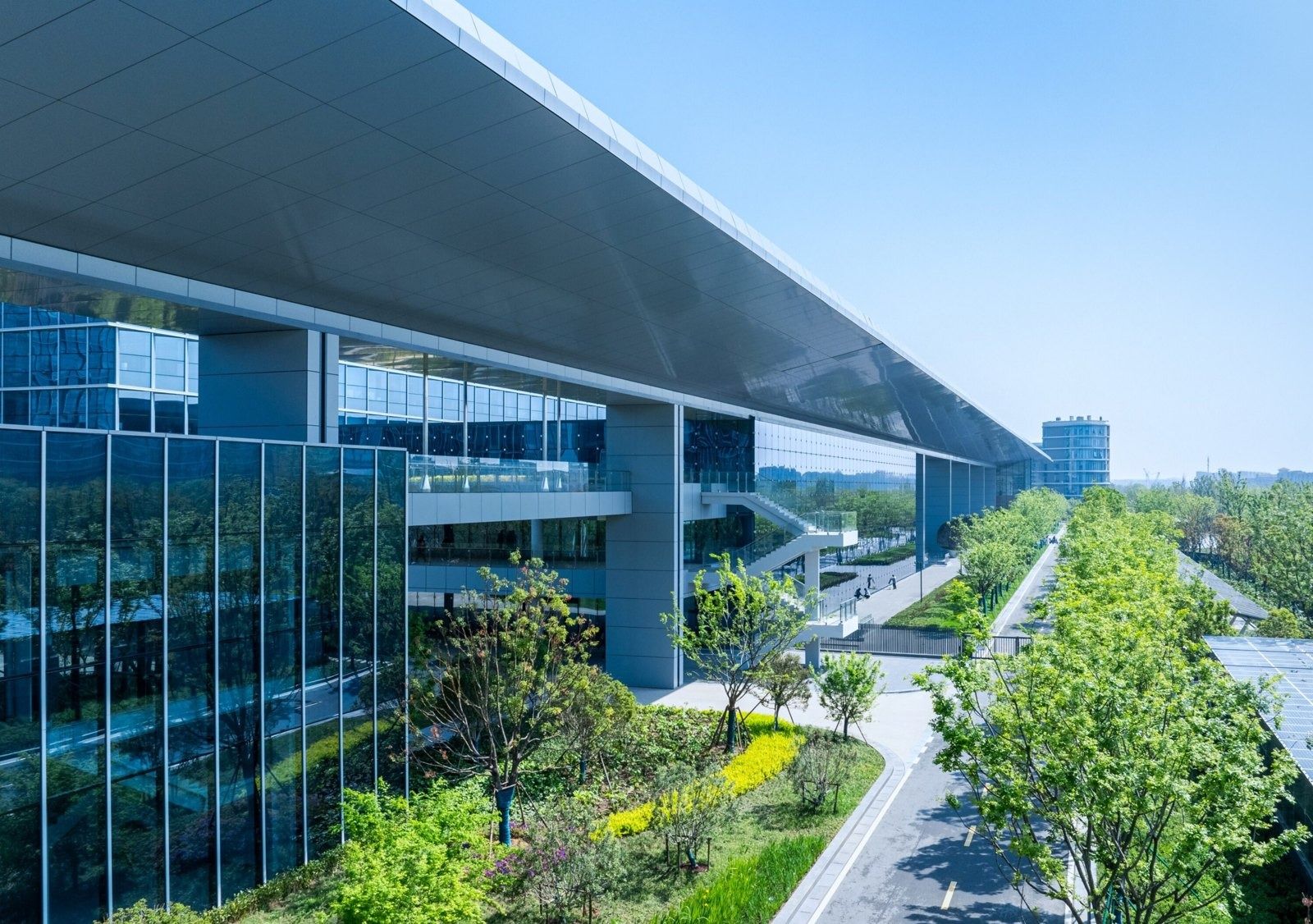 Alibaba Group: Long roof canopy over a planted walkway