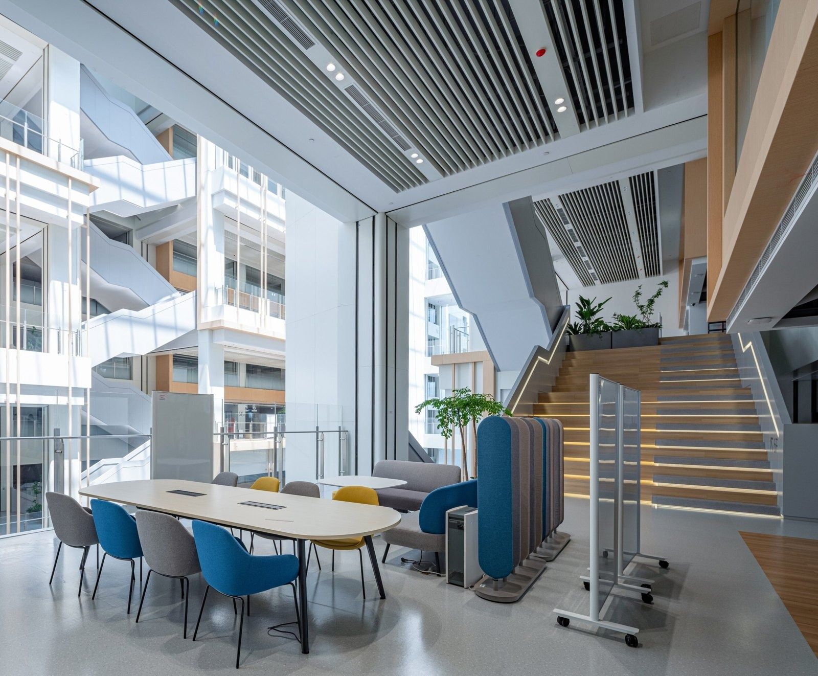 Alibaba Group: Meeting table beside a staircase