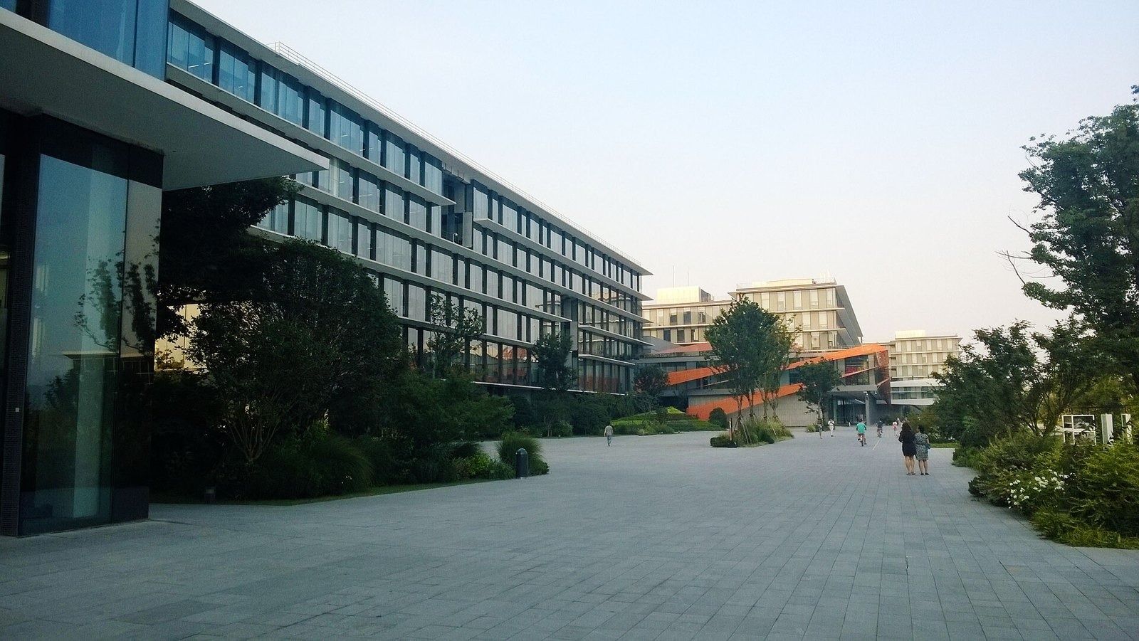 Modern office buildings beside a paved plaza