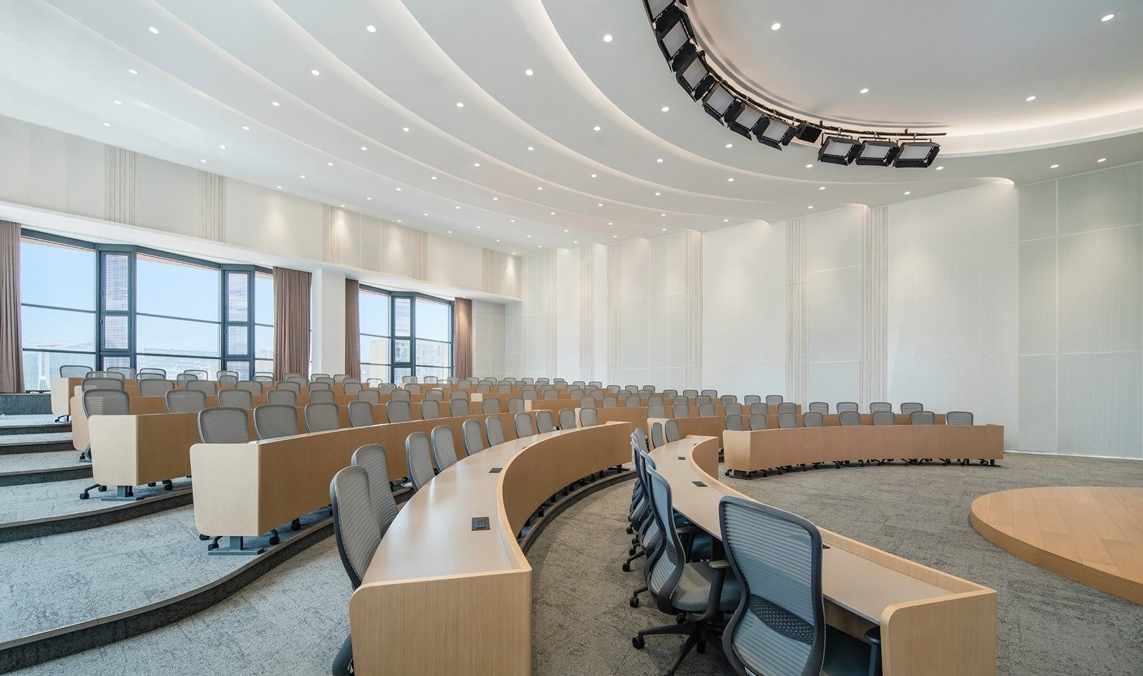 Alibaba Group: Tiered conference room with curved desks