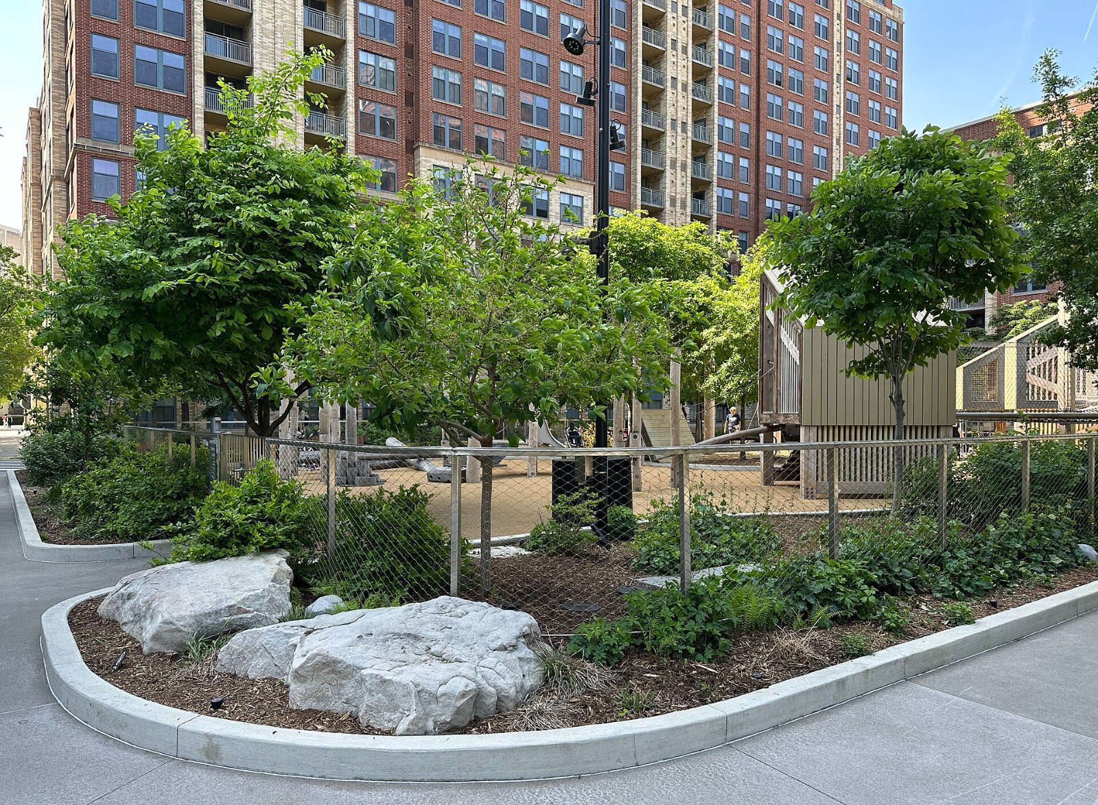 Curved planting bed with boulders