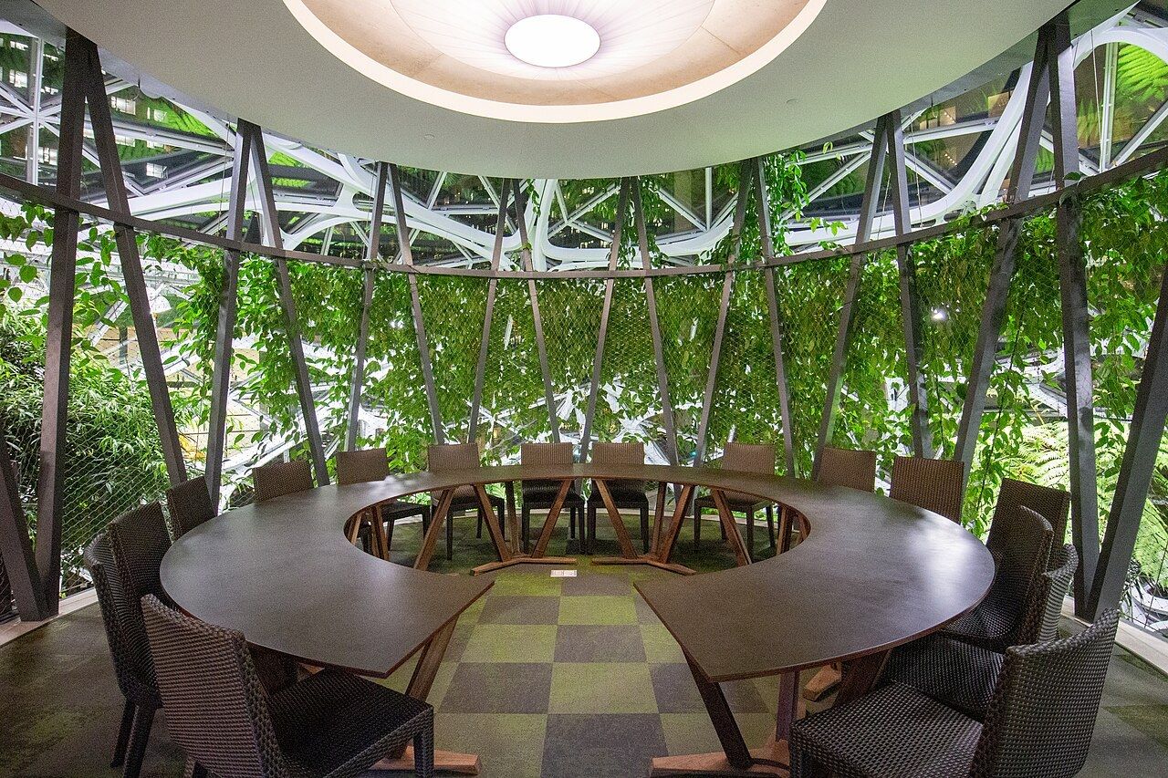 A round meeting room inside the Spheres surrounded by plants