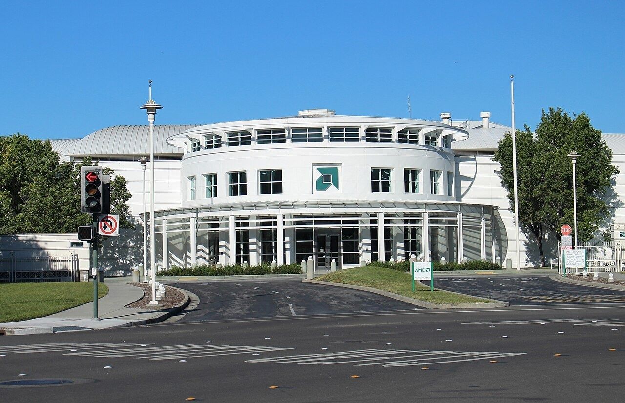 Round white entrance building at One AMD Place