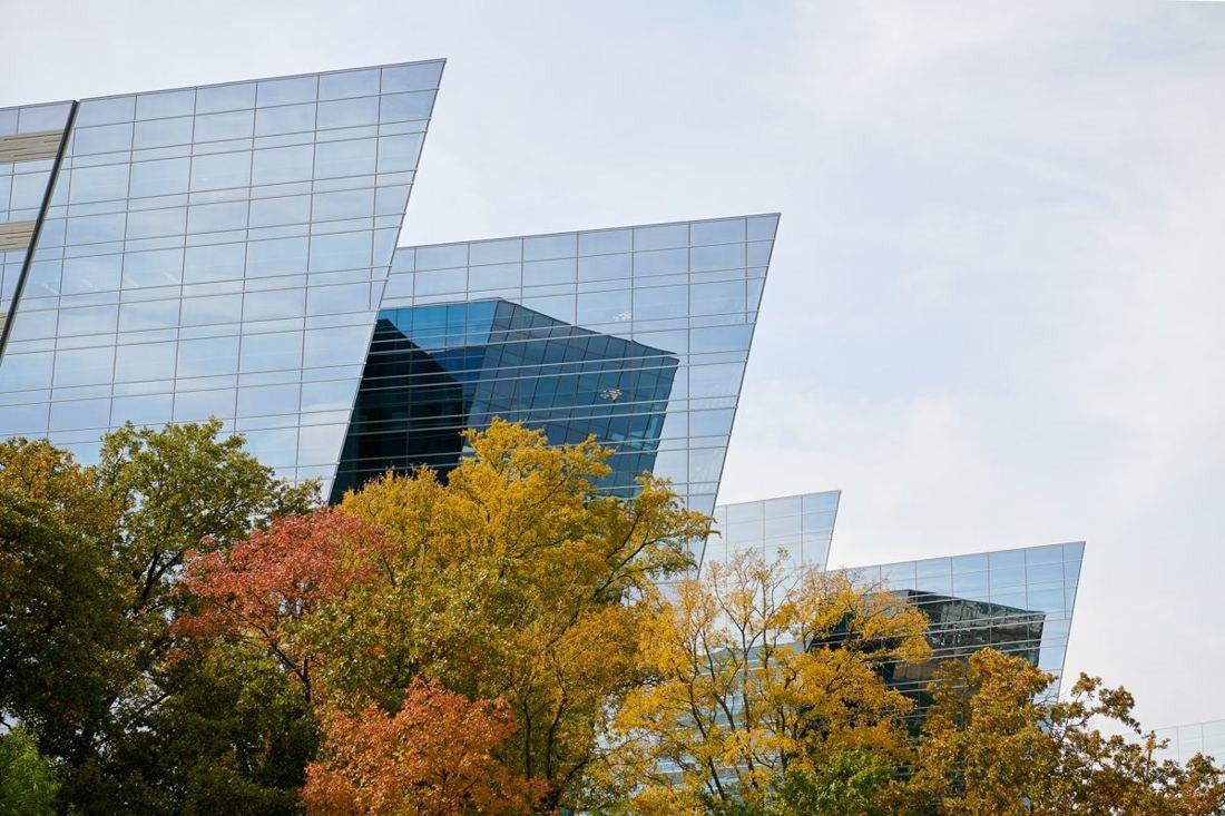 American Airlines: Angular glass facades above autumn-colored trees
