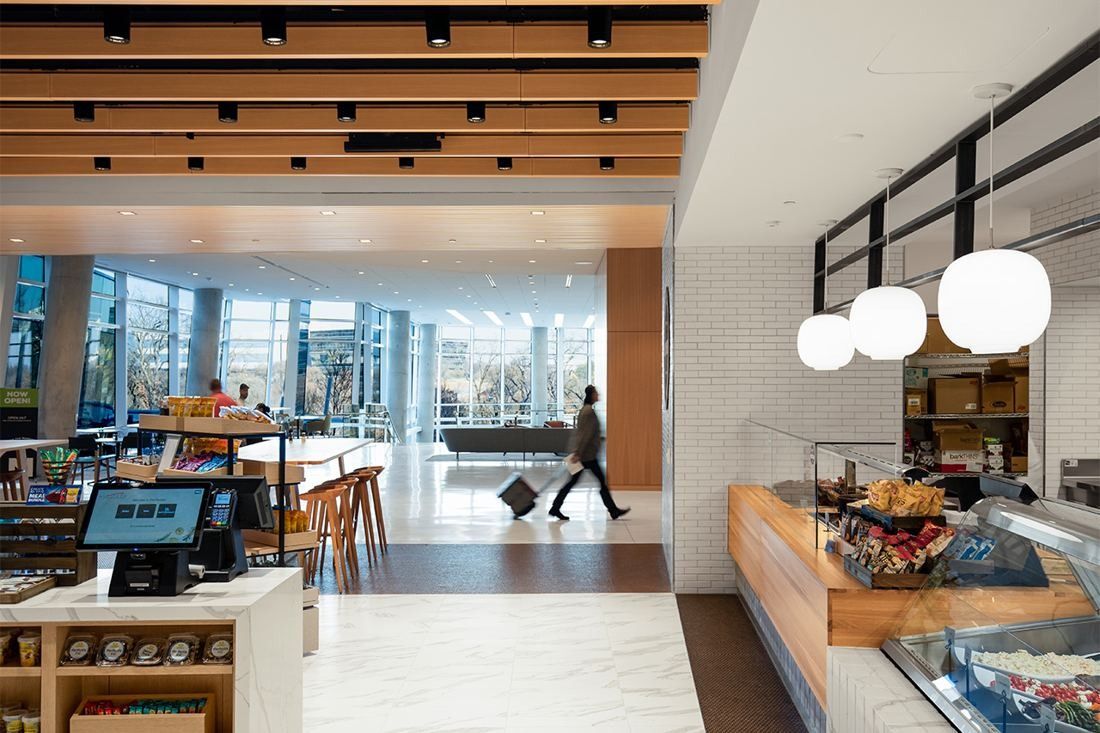 American Airlines: Café counter with pendant lamps and a glass wall looking outside