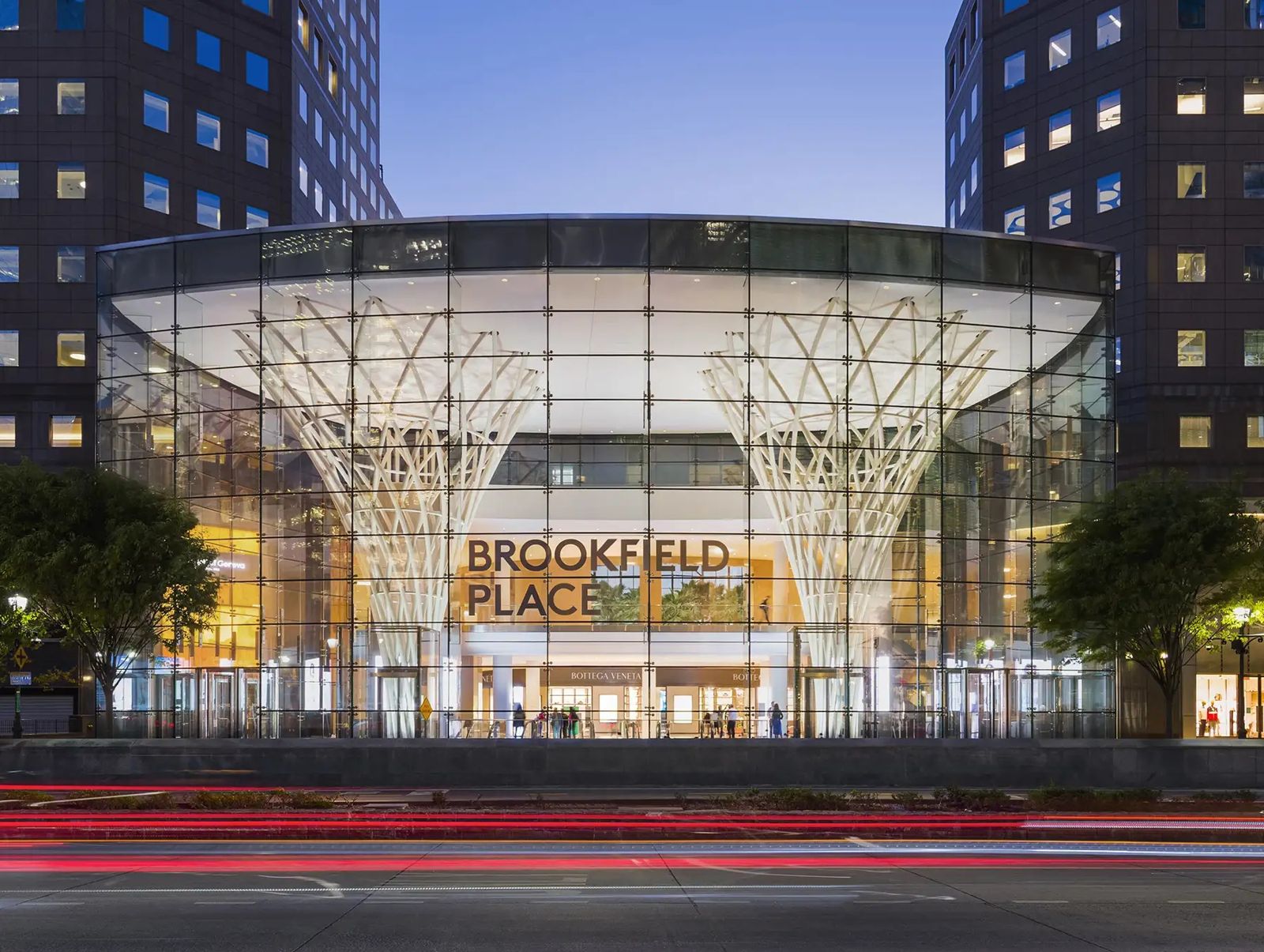 American Express: Glass pavilion entrance at dusk