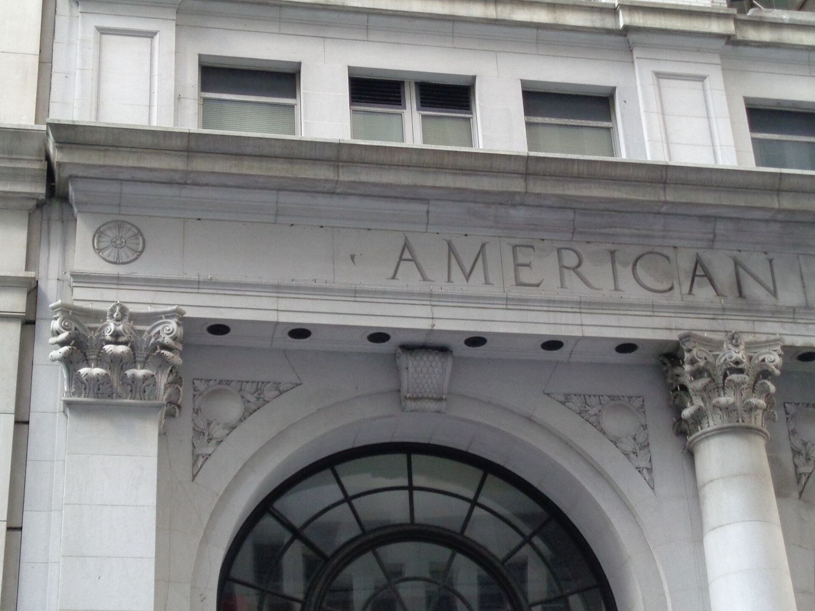 Stone entrance carved with the words American Express