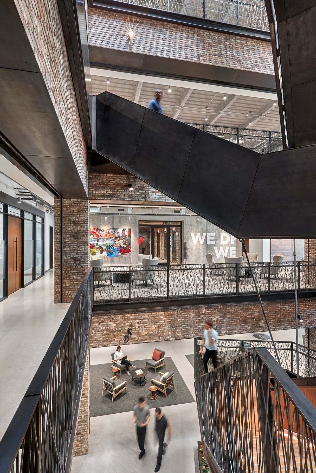 Aramark: A tall atrium with a black steel stair