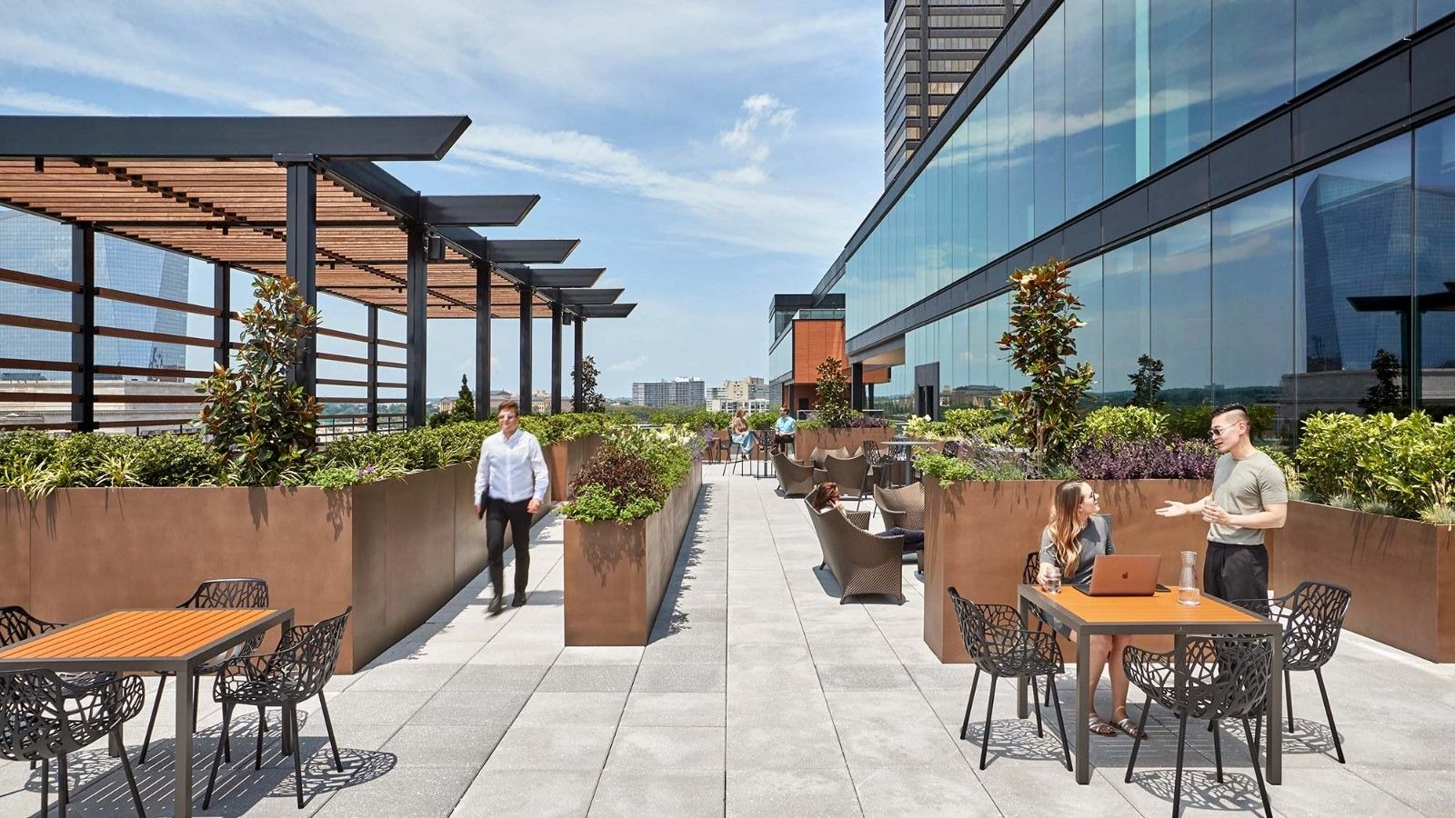 Aramark: An outdoor terrace with tables and planters