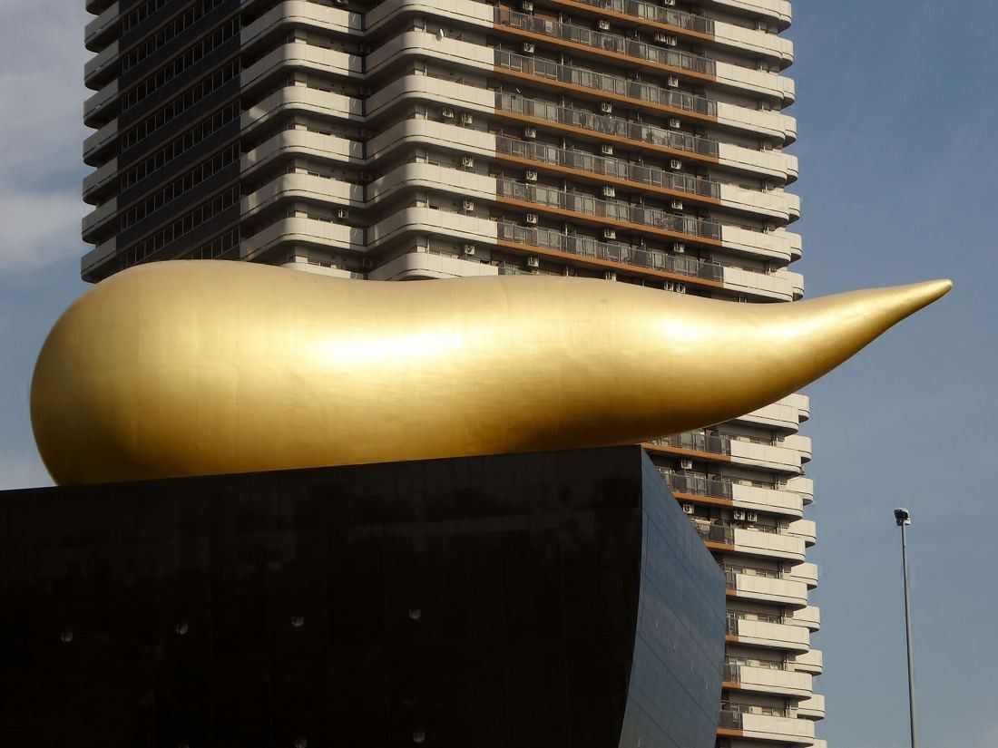 Asahi Group Holdings: Close view of the golden flame sculpture on the black hall roof