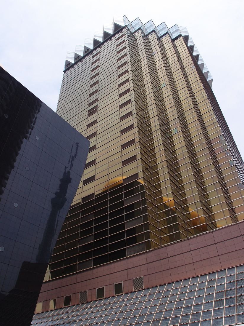 Asahi Group Holdings: Looking up the gold glass tower from its base