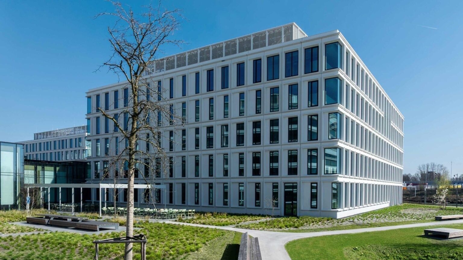 A white office building with planting