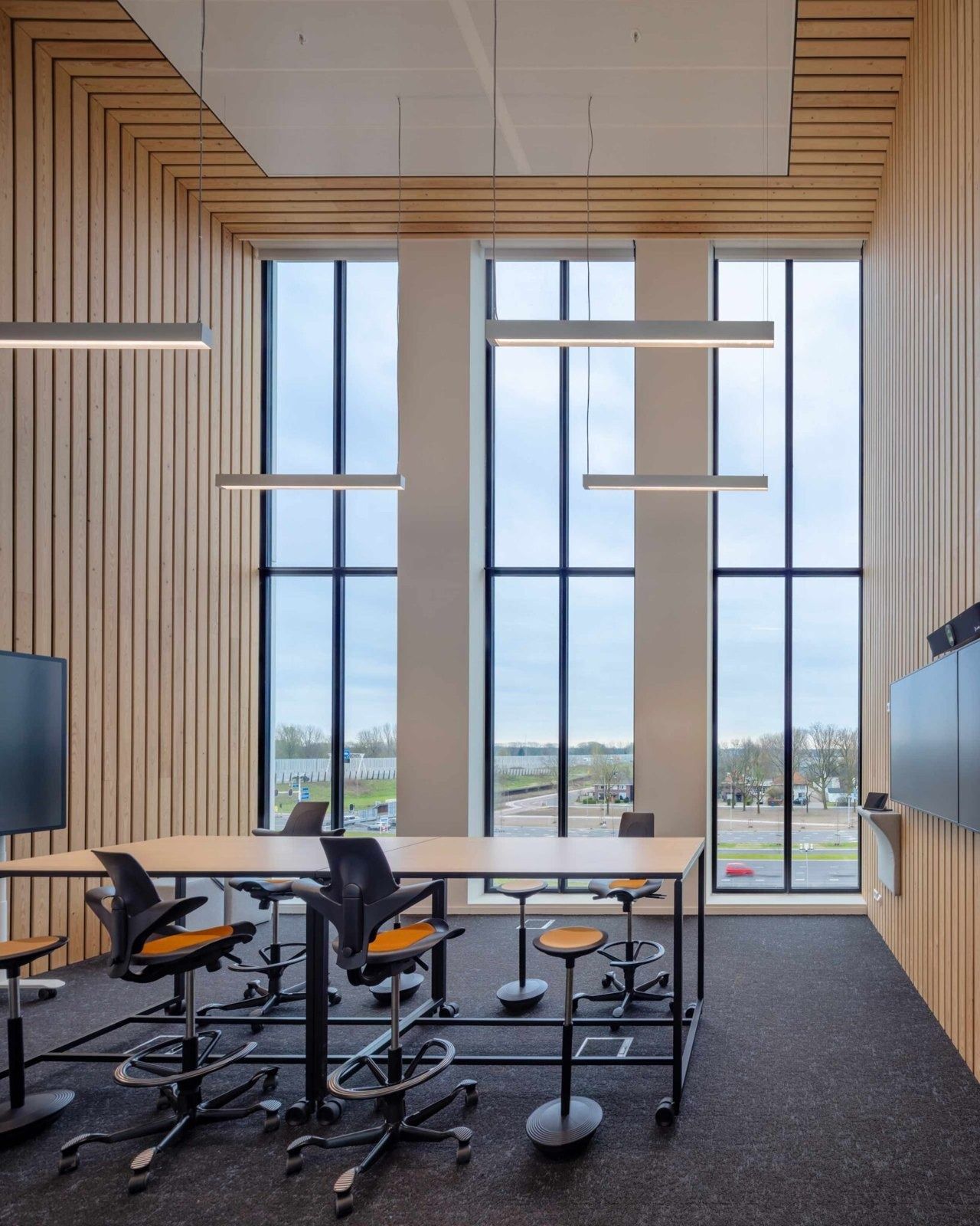 High desks by tall windows