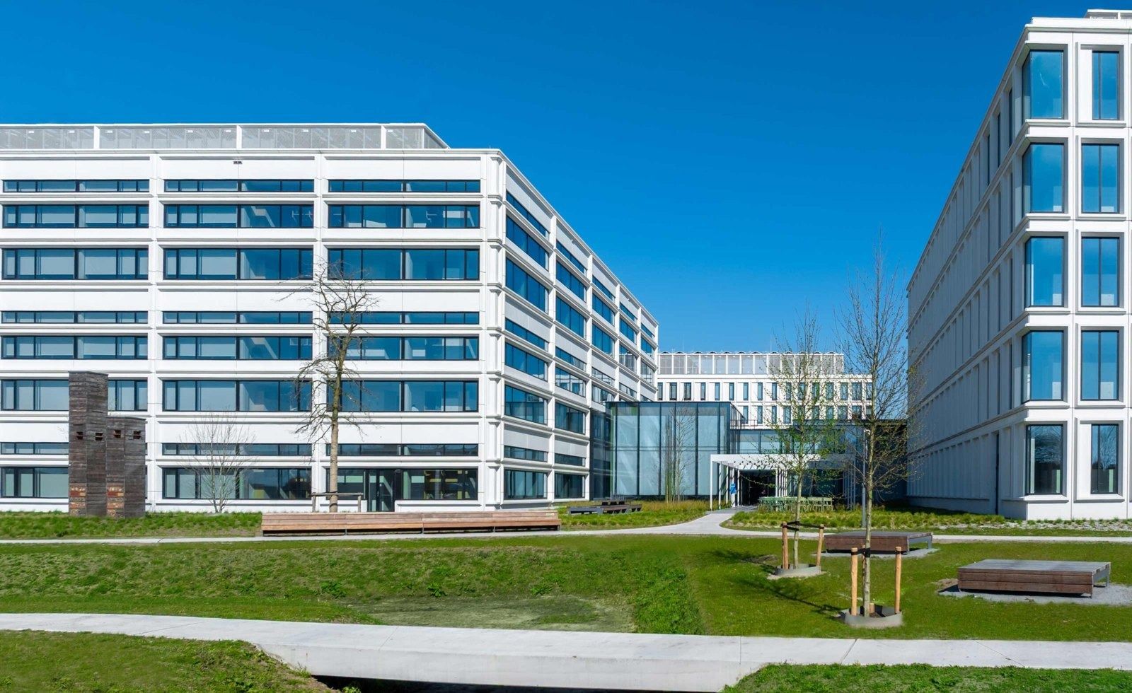 White office buildings around a green courtyard