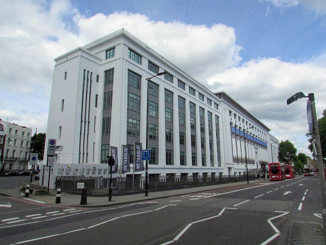 ASOS: Corner view of the long white building along a wide road