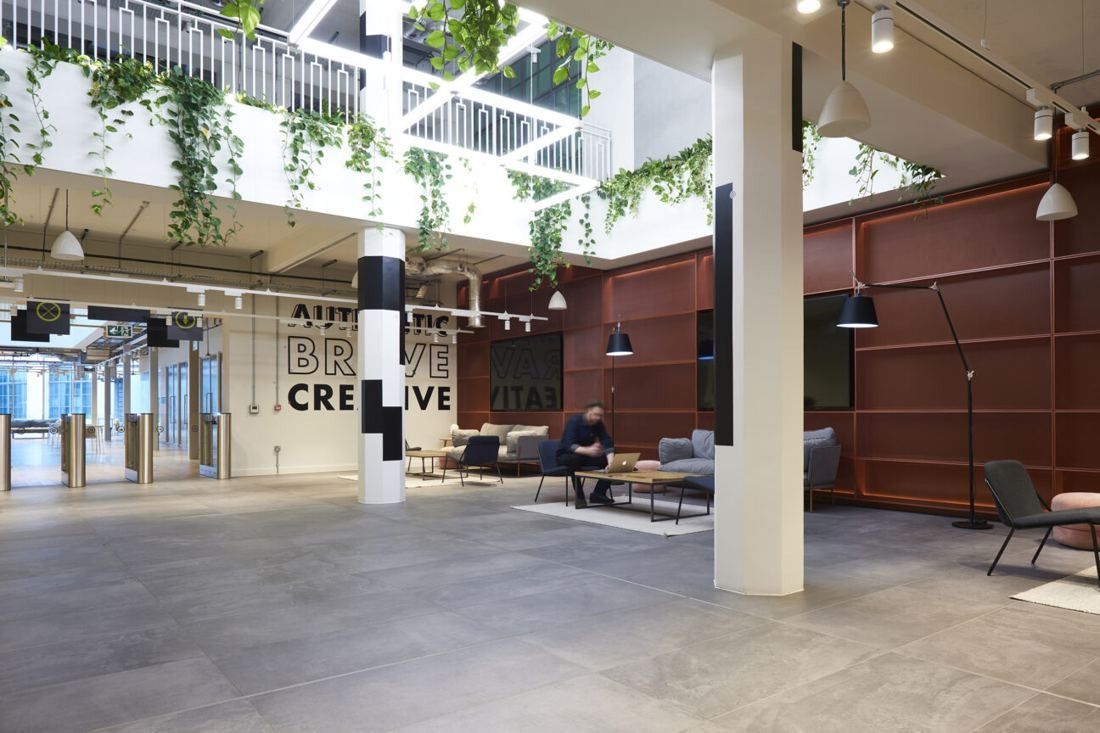 ASOS: Open ground-floor space with columns, hanging plants and lettering on a wall