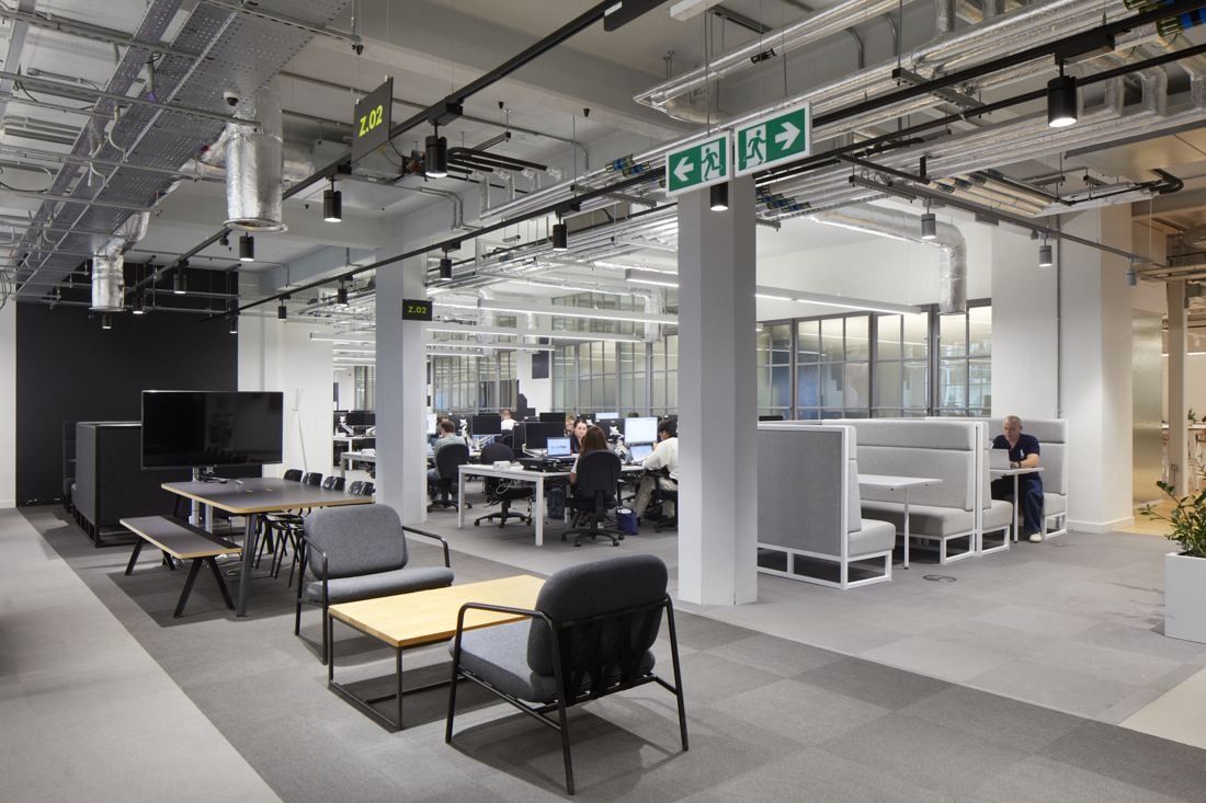 ASOS: Open-plan office with desks, monitors and a lounge corner