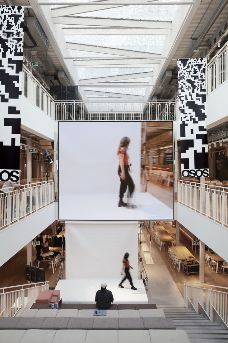 ASOS: Tall atrium with a large screen hanging above stepped seating
