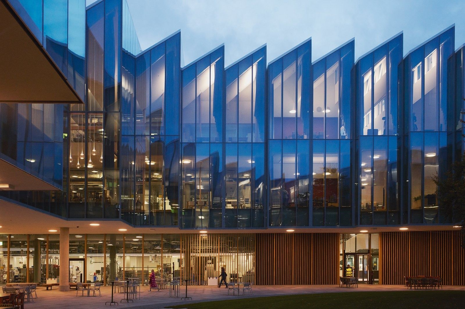 AstraZeneca: Building lit at night with a zigzag glass façade