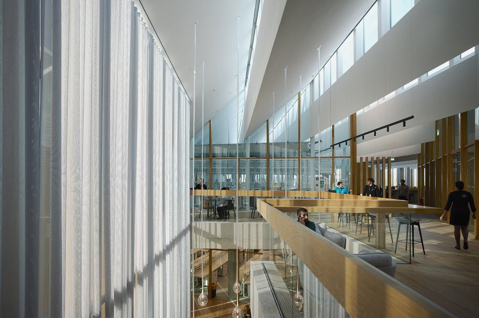 Tall bright void with bridges between floors