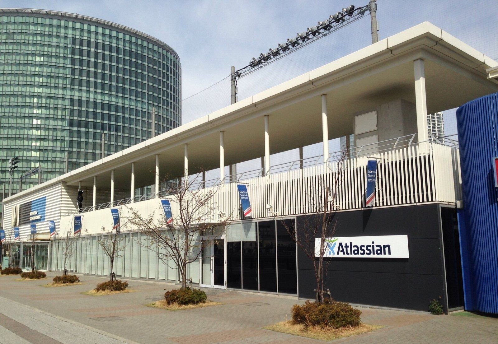 A low office building with an Atlassian sign