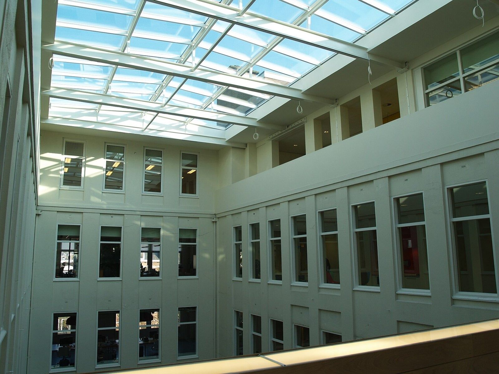 Atlassian: A skylit atrium with white windows