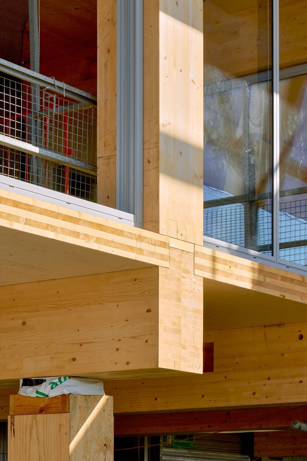 Atlassian: A timber column and beam joint beside a balcony