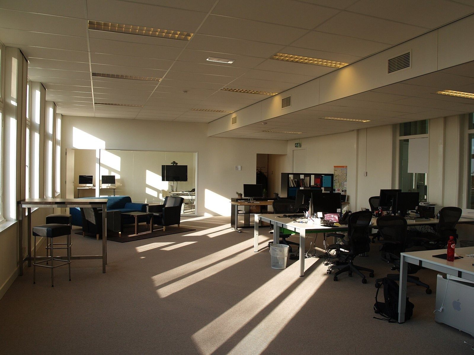 Atlassian: An office floor with desks and sunlight