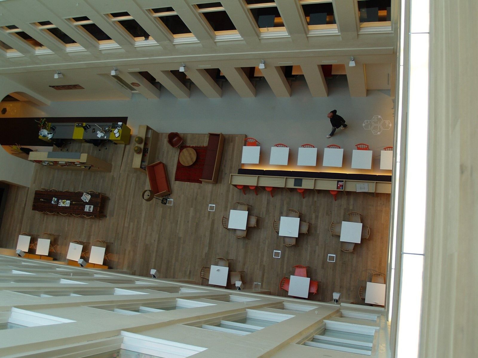 Atlassian: Desks and lounges seen from the top of an atrium