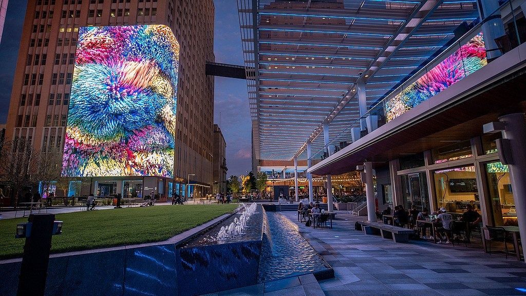 AT&T: Video wall on a tower above a lawn at dusk