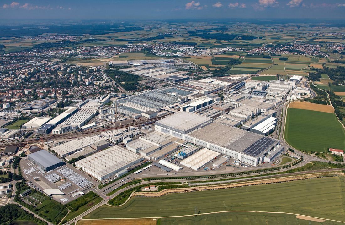 Audi: Aerial view of a large factory site with the town beyond and fields around it