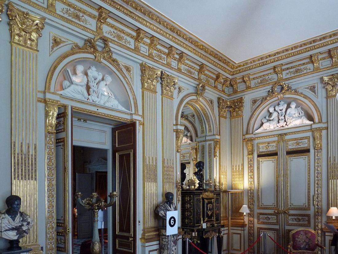 AXA: Gilded salon with arched doors and carved overdoors