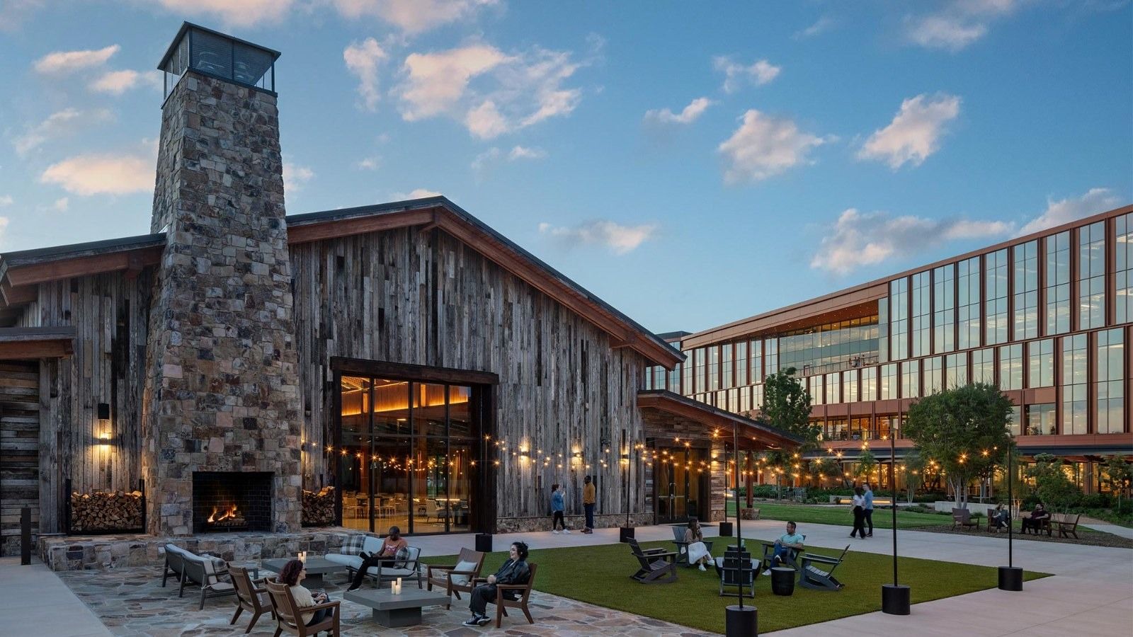 An outdoor plaza with a big stone fireplace